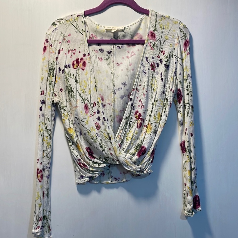 Small white floral wrap shirt. Slight bell sleeve